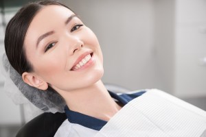 woman with a healthy smile after a root canal with GentleWave Ultracleaning procedure